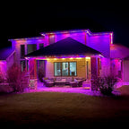 Covered patio with vivid pink and purple permanent LED roofline lighting