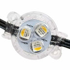 Home roofline illuminated with multicolor permanent RGBW LED lights at night