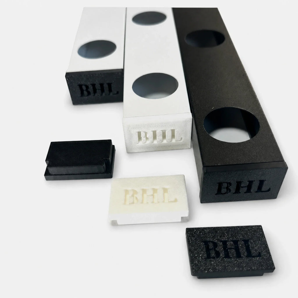 Black and white permanent LED track samples with matching loose track end caps