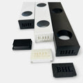 Black and white permanent LED track samples with matching loose track end caps
