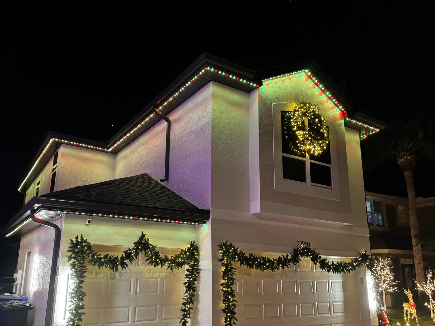 Large estate outlined with warm-white permanent LED roofline lights