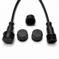 Five black waterproof XConnect caps for male 3-pin cable connectors shown with compatible plug ends