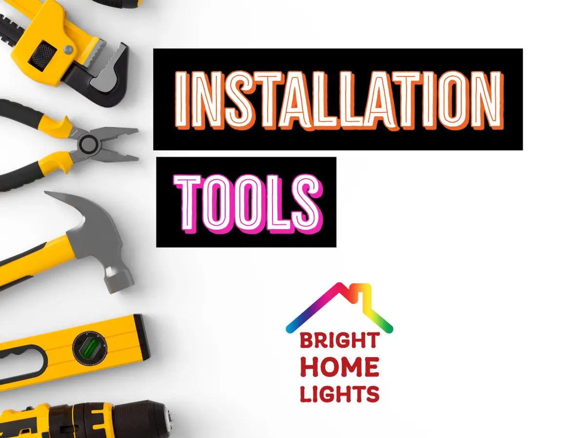 Wire strippers, pliers, level, drill, and hand tools used for permanent LED light installation